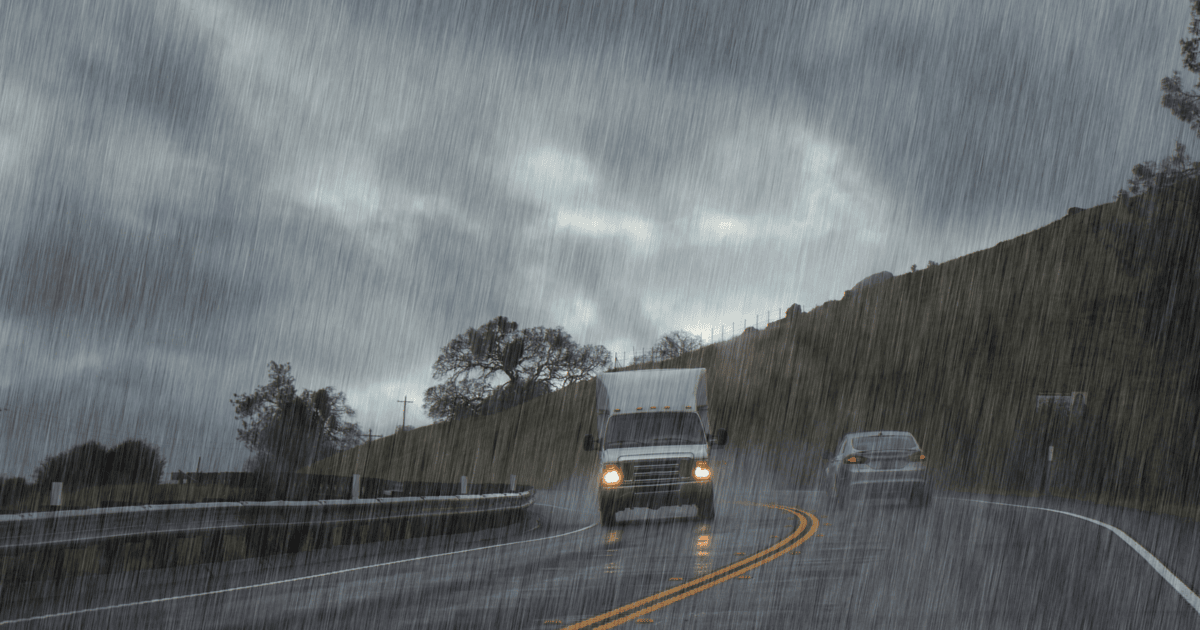 Image of cars driving on wet roads in the rain